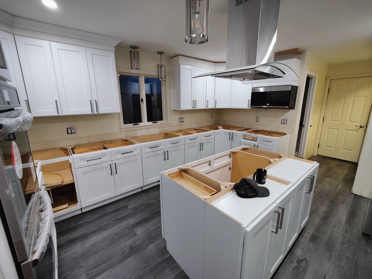 Custom kitchen cabinet installation in progress during remodel