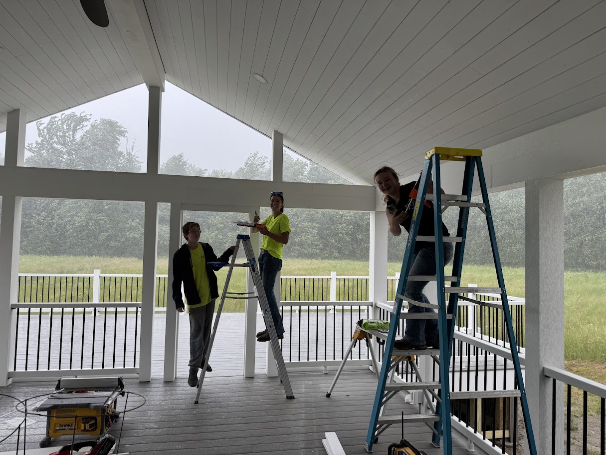 Nailed It 440 crew members installing covered porch framing on residential home