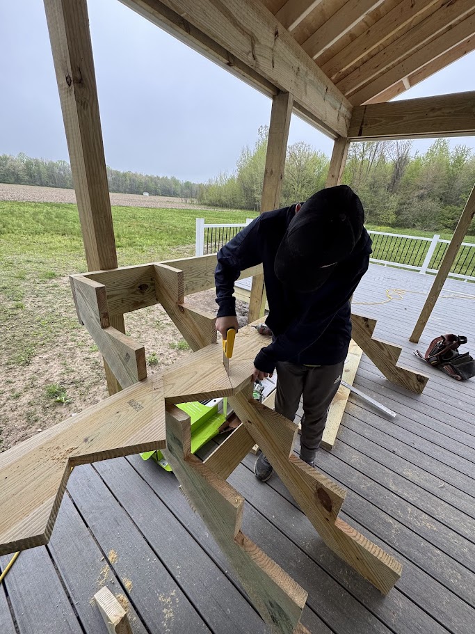 Deck stair construction showing precision framing work
