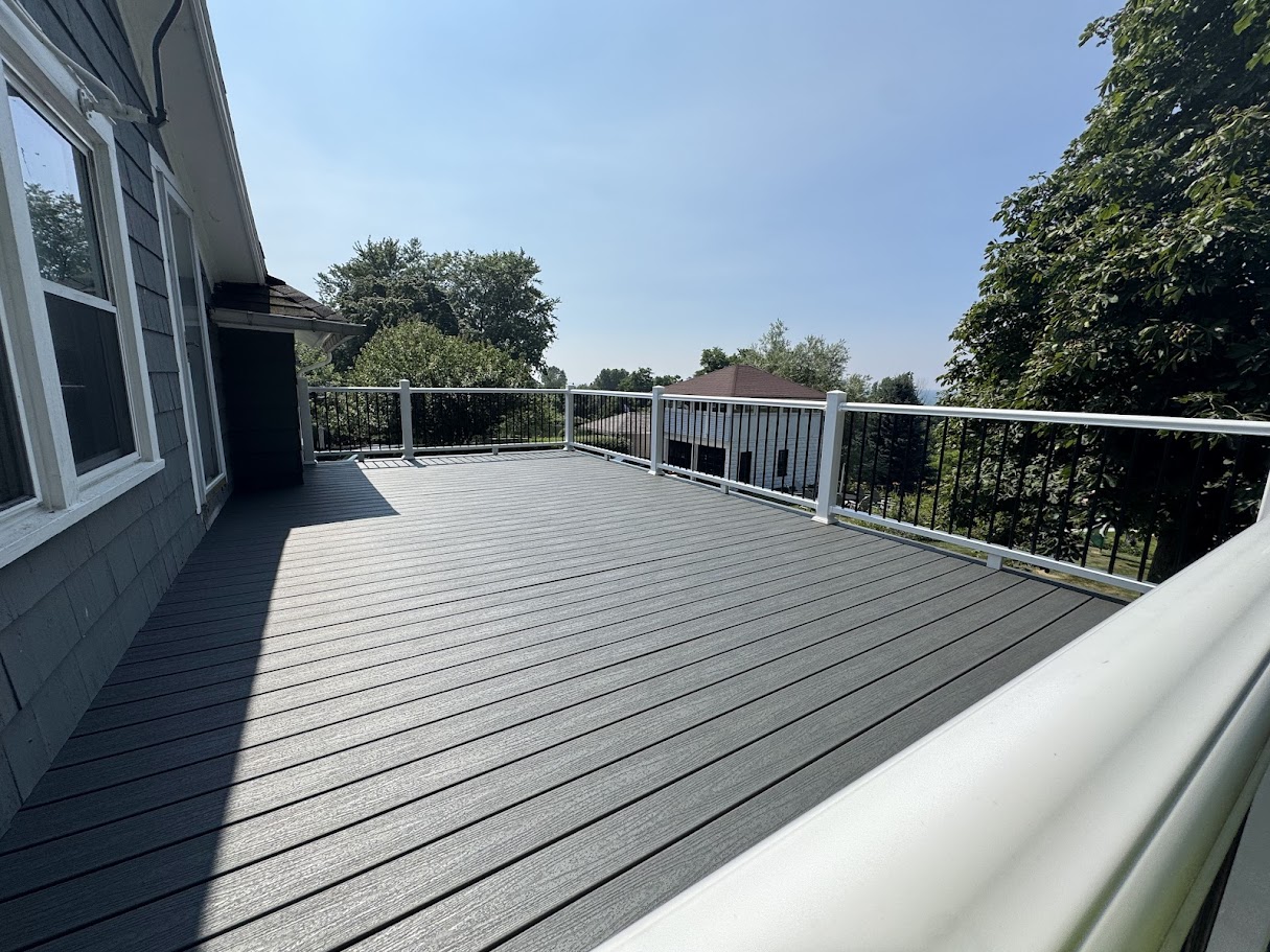 Wraparound deck extending around corners of craftsman-style home