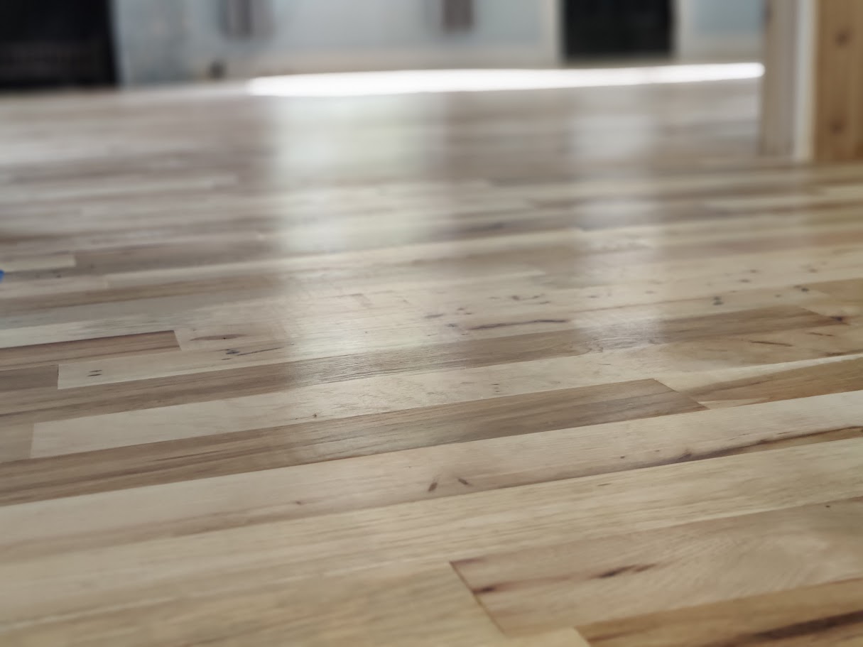 Completed hardwood floor refinishing showing quality craftsmanship