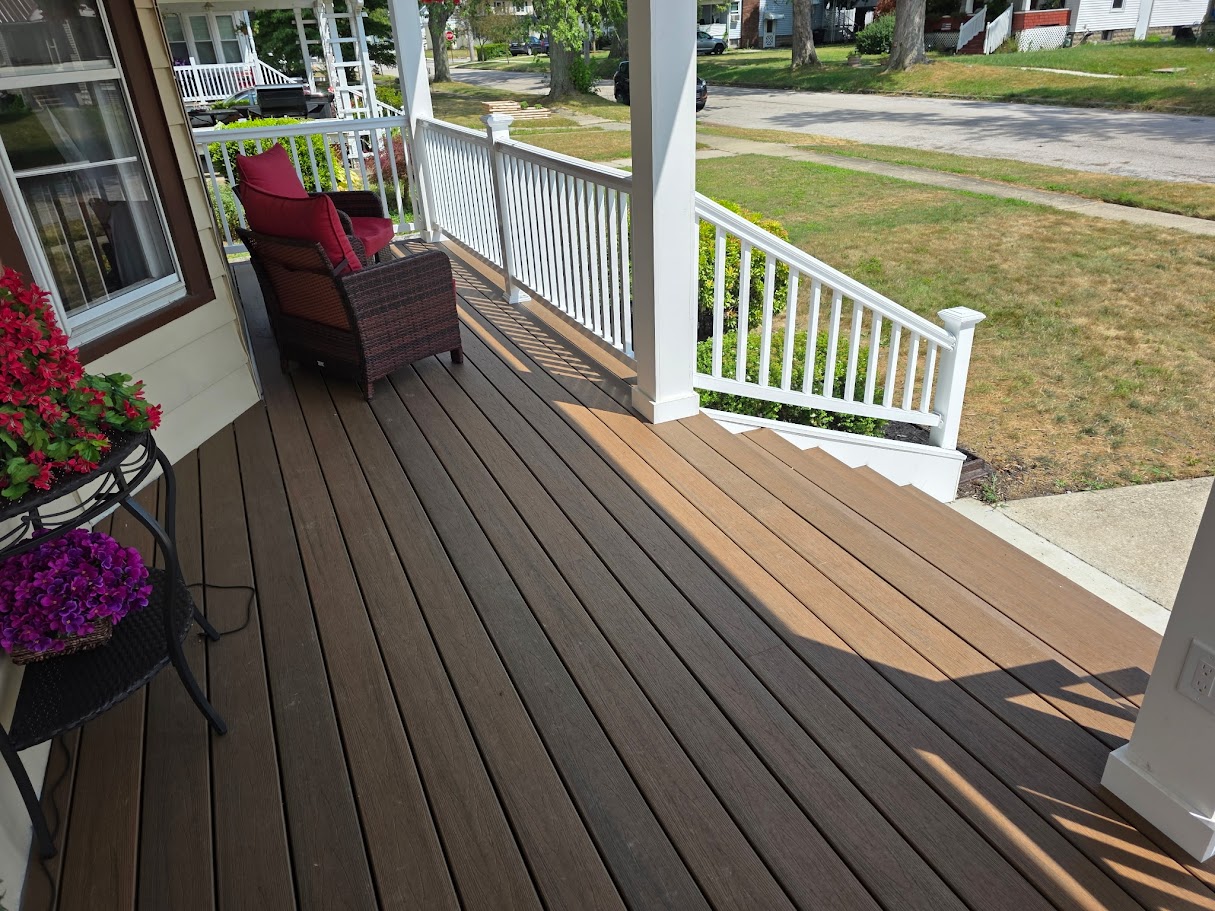 Covered porch with built-in seating area and ceiling fan for comfortable outdoor living