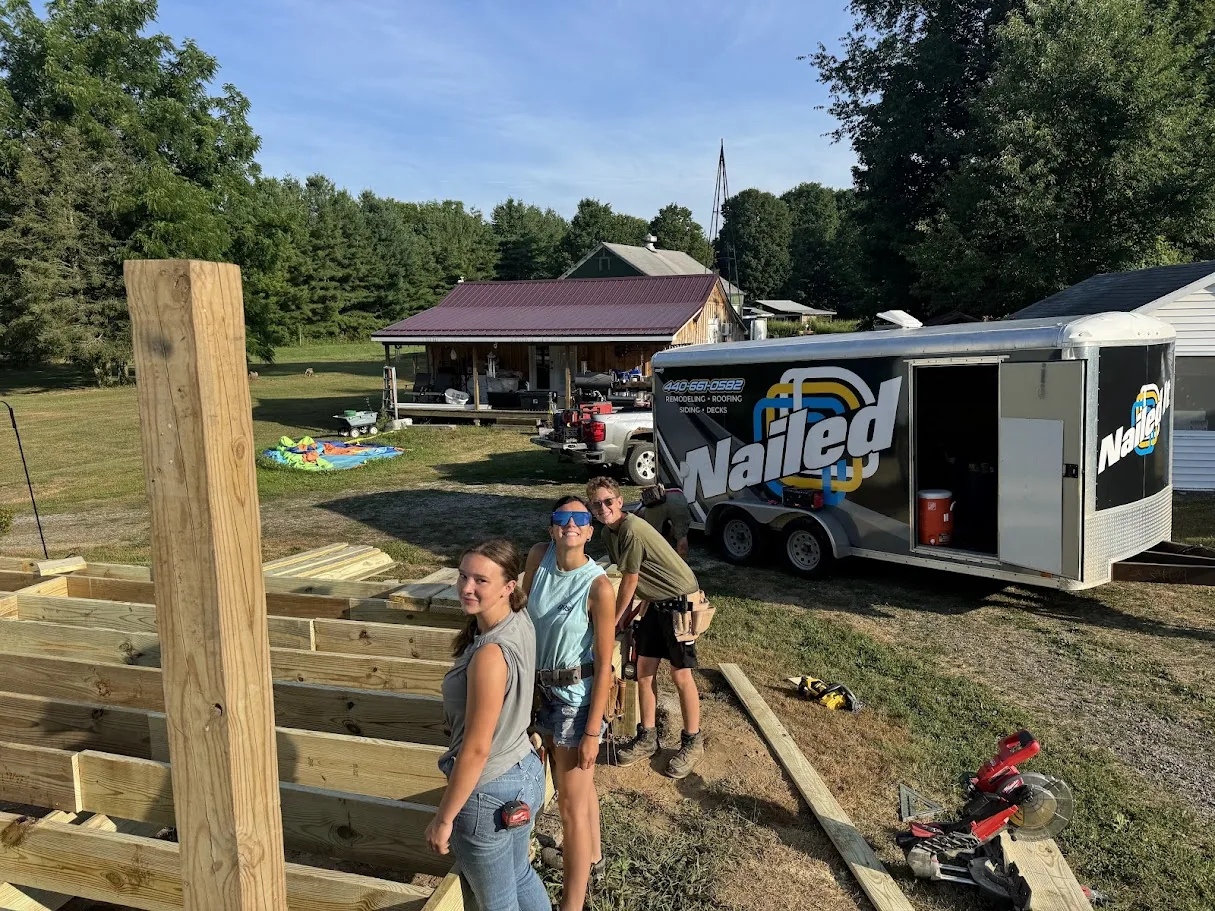 Nailed It 440 construction crew standing by company work trailer in Ashtabula County